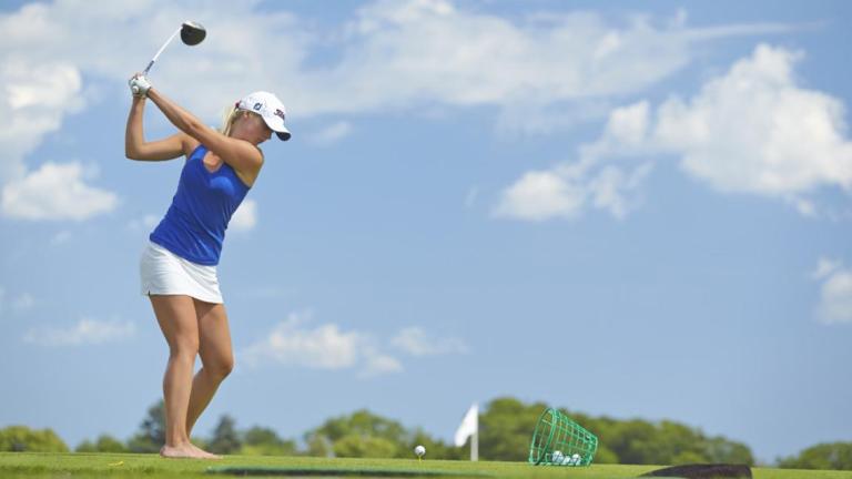 Female golfer driving